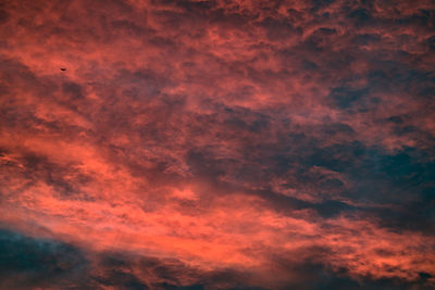 Low angle view of dramatic sky during sunset