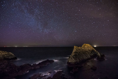 Scenic view of lake at night