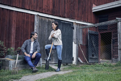 Couple talking at poultry farm