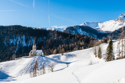 Snow covered mountains against sky
