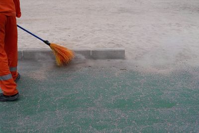 Low section of person working on floor