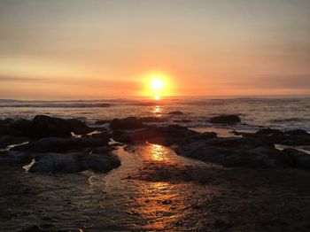 Scenic view of sea against sky during sunset