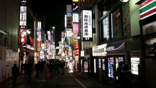 Illuminated buildings in city at night