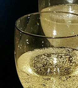 Close-up of wine glass on wooden table