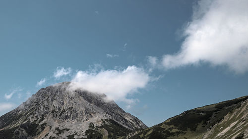 Low angle view of volcanic mountain against sky