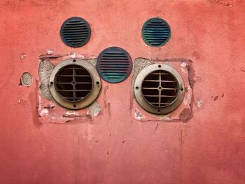 Low angle view of window on brick wall