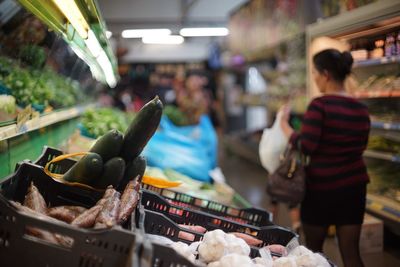 Rear view of woman walking in supermarket