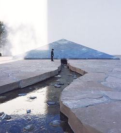 Silhouette of woman against sky