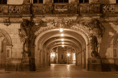 Illuminated corridor of historic building
