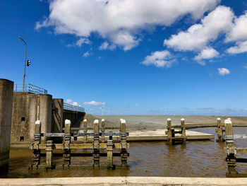 Scenic view of harbor against sky