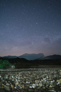 Scenic view of rocks at night