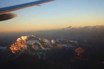 Aerial view of mountains against sky during sunset