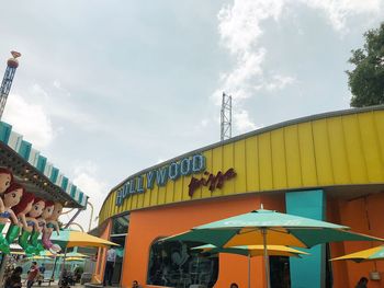 Low angle view of amusement park ride against sky