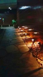 Close-up of illuminated lights at sunset