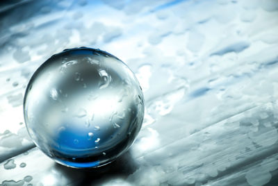 Close-up of water drops on crystal ball