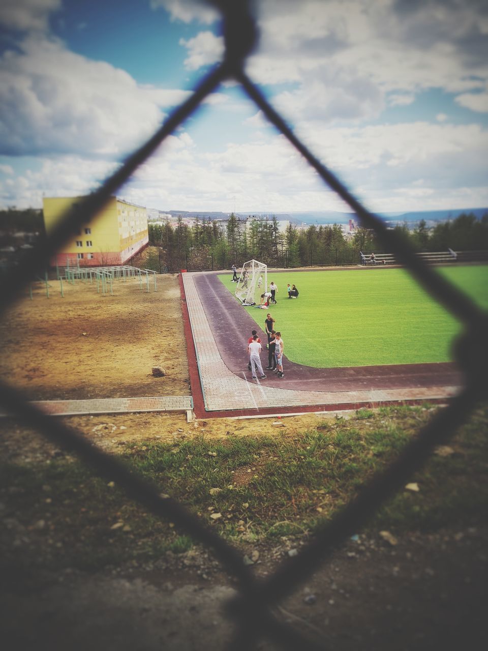 SCENIC VIEW OF FIELD SEEN THROUGH FENCE