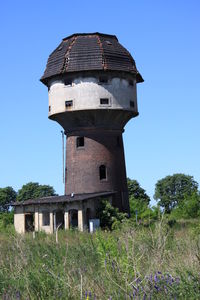 Low angle view of old tower against clear sky