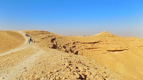 Scenic view of desert against clear sky