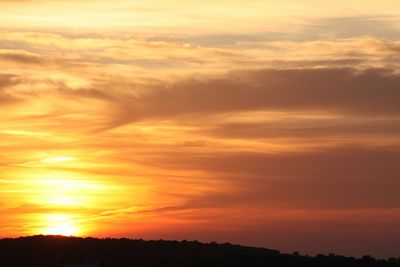 Low angle view of dramatic sky during sunset