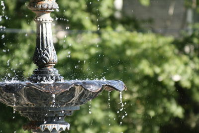 Close-up of water fountain against blurred background