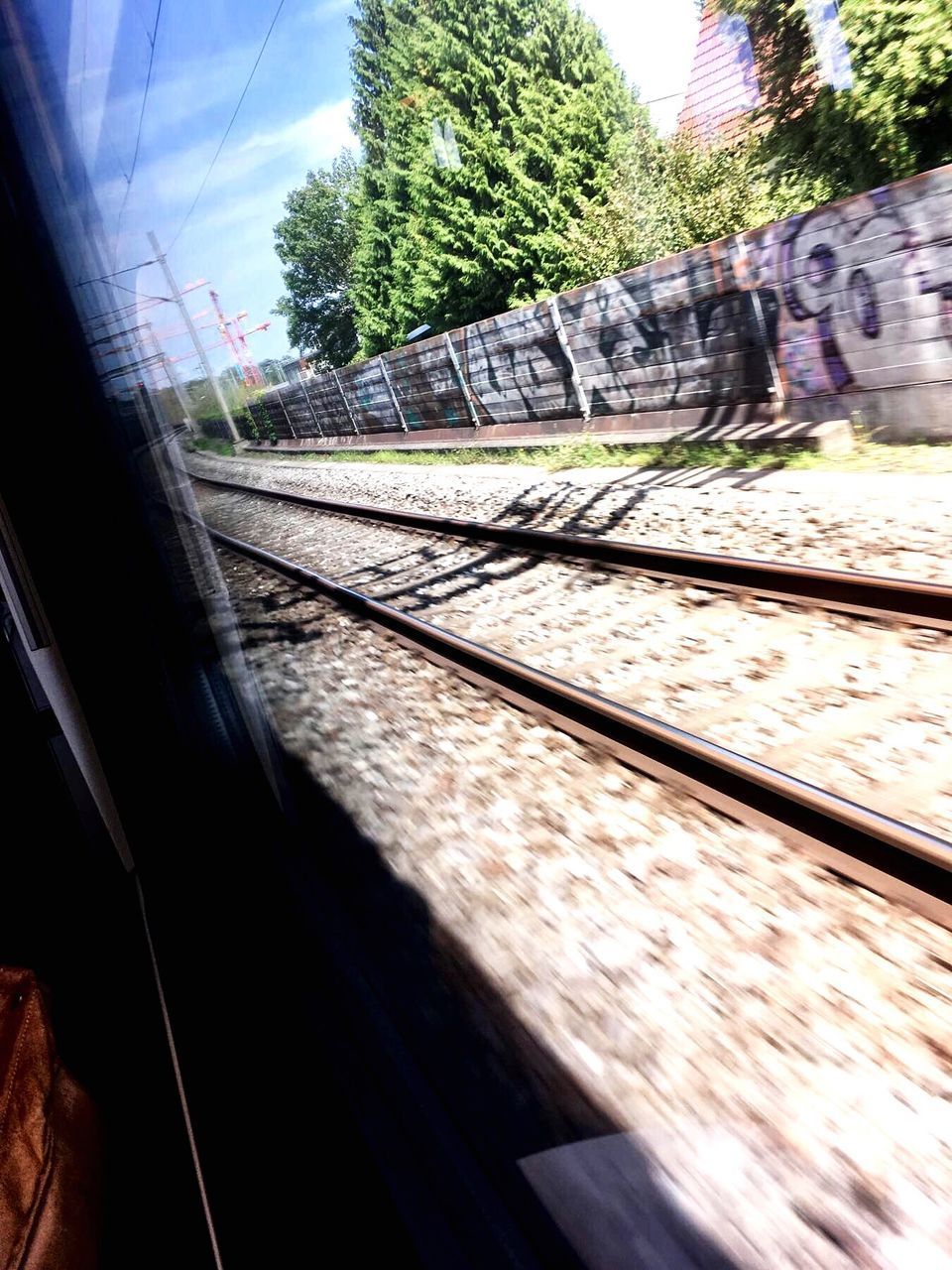 CLOSE-UP OF TRAIN ON RAILWAY TRACK