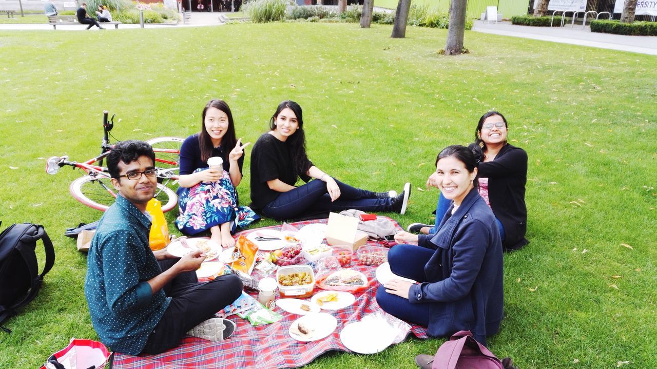 togetherness, full length, grass, casual clothing, bonding, sitting, young women, love, childhood, leisure activity, girls, relaxation, friendship, family, person, front view, looking at camera, young adult, enjoyment, day