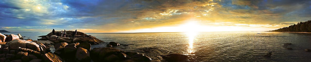 Close-up of sea against sky at sunset