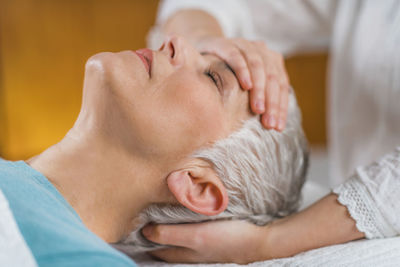 Close-up of woman getting massage at spa