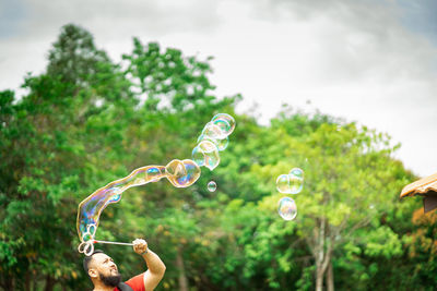 Full length of bubbles in mid-air