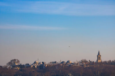 View of buildings in city against sky