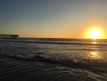 Scenic view of sea against sky at sunset