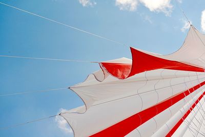 Low angle view of flag against blue sky