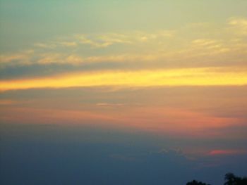 Low angle view of dramatic sky during sunset