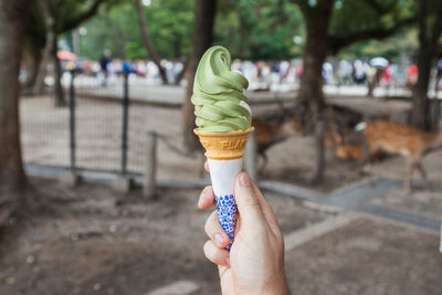 Woman holding ice cream cone