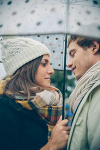 Portrait of young couple looking away