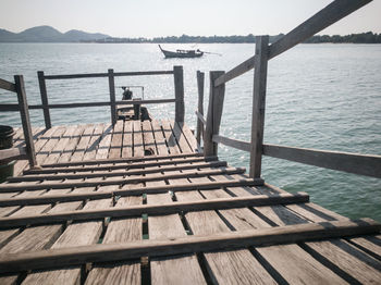 Pier on sea against sky