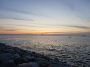 Scenic view of sea against sky at sunset