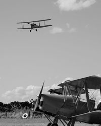 Low angle view of airplane against sky