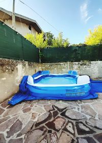 View of swimming pool against house