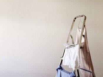 Close-up of clothes hanging on ladder