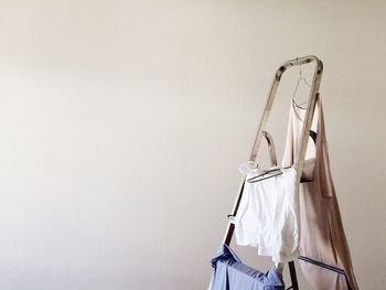 Close-up of clothes hanging on wall