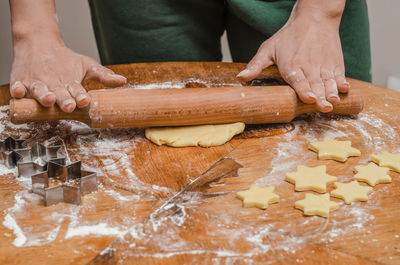 Rolling dough for sweet biscuits in the kitchen