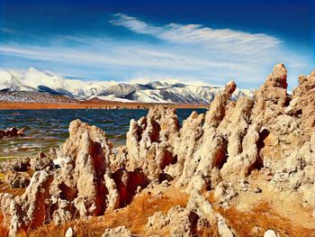Panoramic view of snowcapped mountains against sky