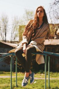 Young woman sitting outdoors