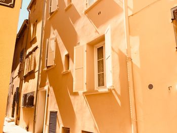 Low angle view of residential building on sunny day