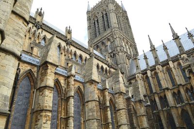 Low angle view of clock tower in city