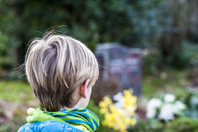 Close-up of boy in graveyard