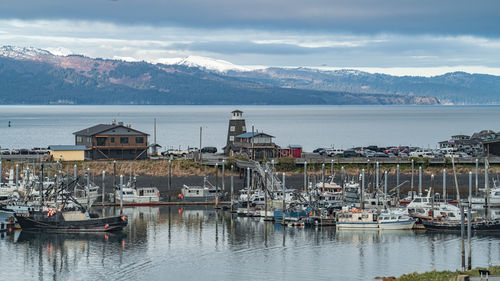 Boats moored at harbor