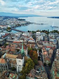 High angle view of river by buildings against sky