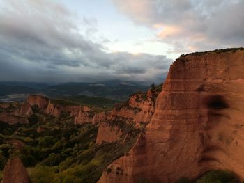 Scenic view of cliff against sky